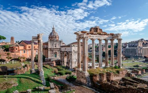 Roman ruins under cloudy sky