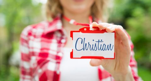 Woman wearing Christian name tag