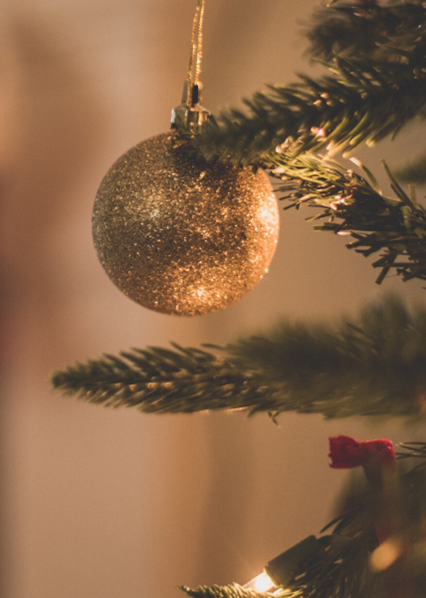 Gold ornament on Christmas tree