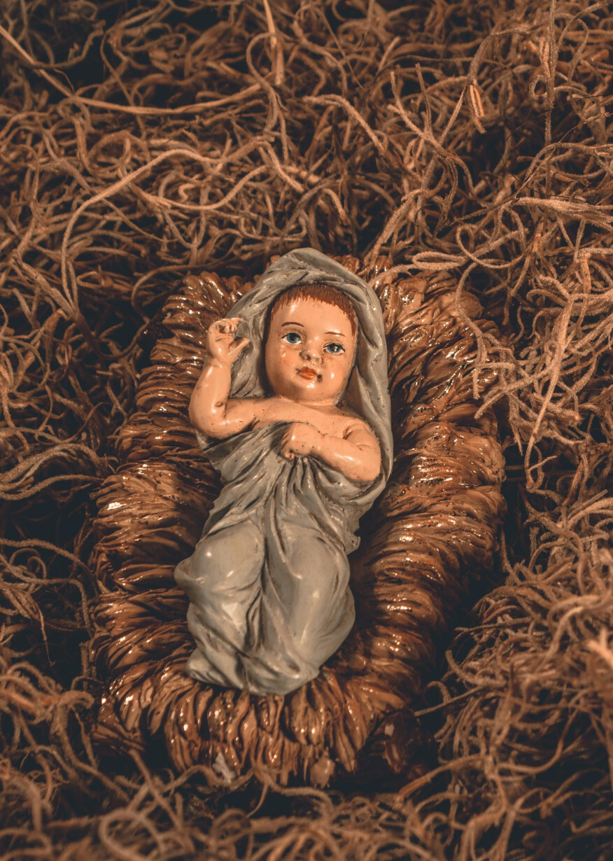 Baby Jesus figurine in manger