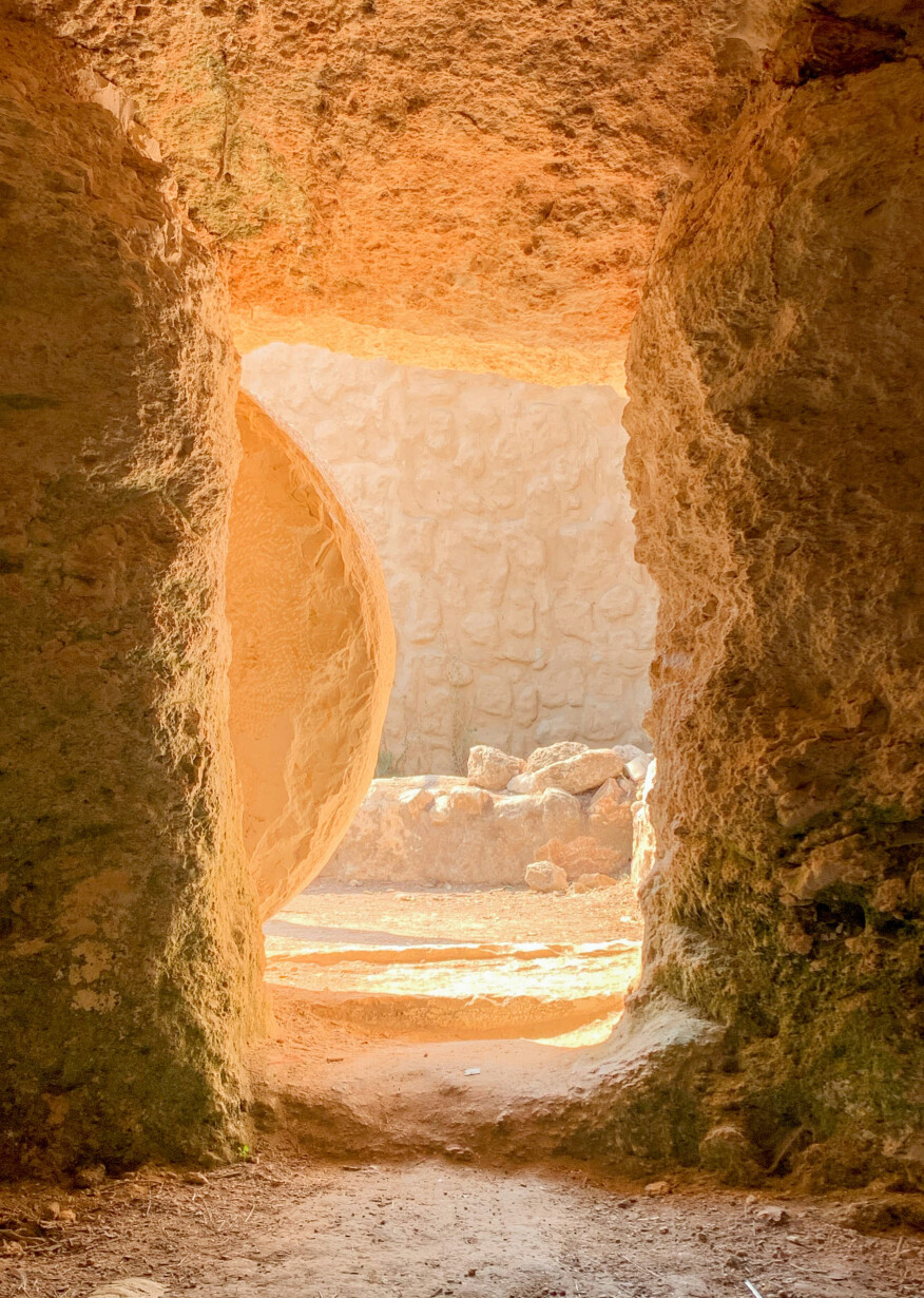 Empty tomb of Jesus with onlookers