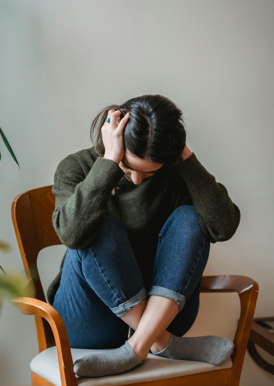 Anxious woman sitting on chair