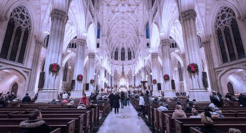 Rows of wooden pews inside church