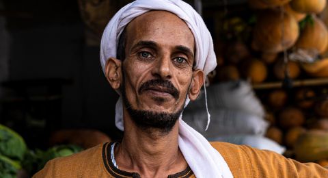 Middle Eastern man wearing white headscarf