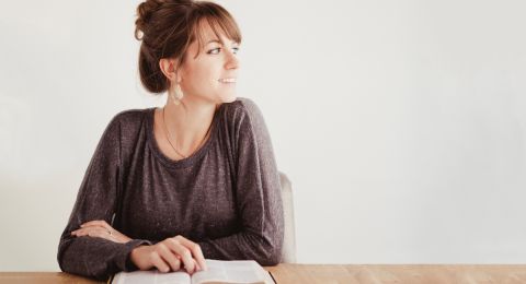 Woman studying Bible at desk