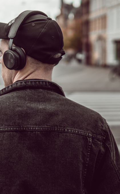 Man with headphones and cap