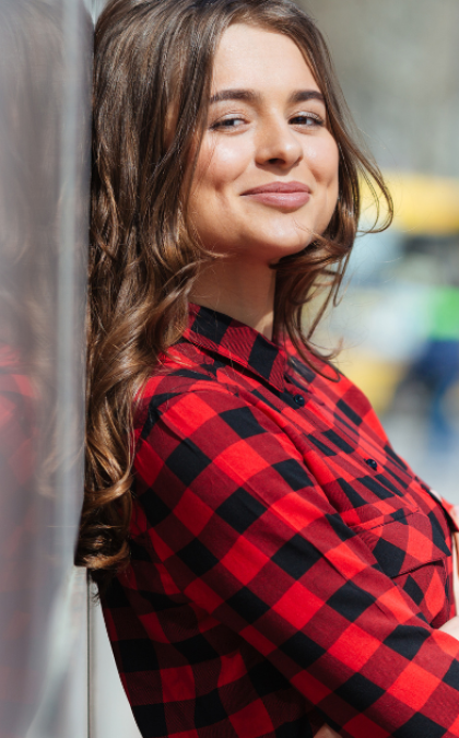 Woman wearing red plaid shirt