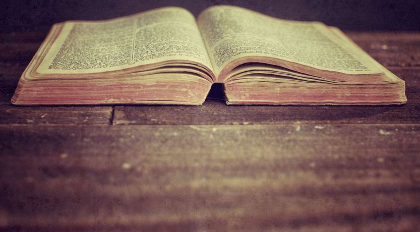 Bible on rustic wooden surface