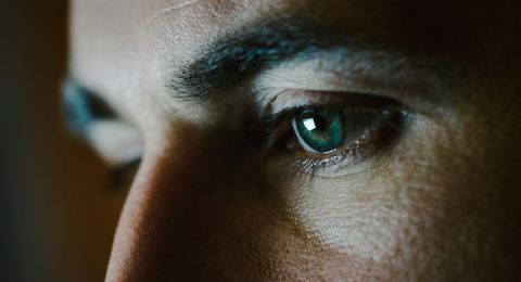 Closeup of man's intense blue eye