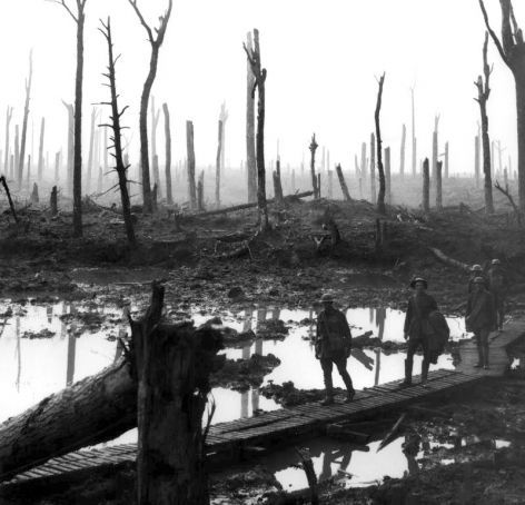 Soldiers walking through destroyed battlefield