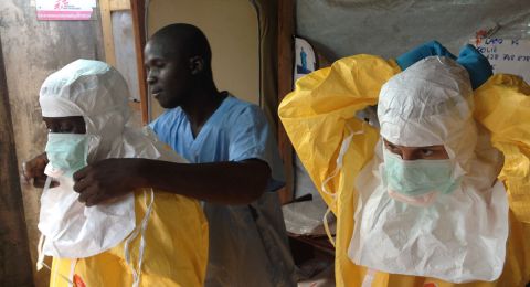 medical workers wearing protective ebola gear