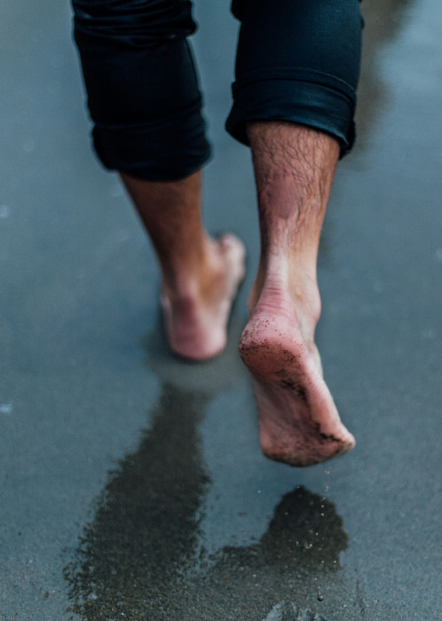 Man walking on sand