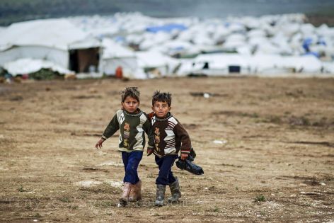 Two children flee Syrian crisis