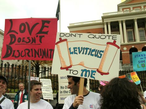 Protesters with religious protest signs