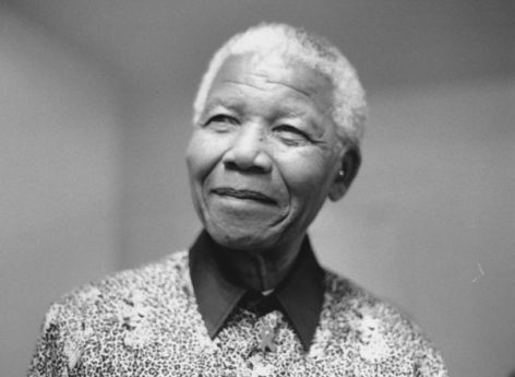 Nelson Mandela smiling at camera