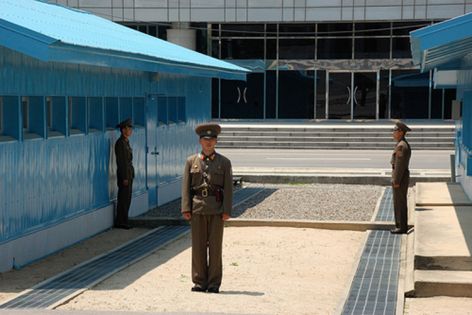 Guard outside North Korean building