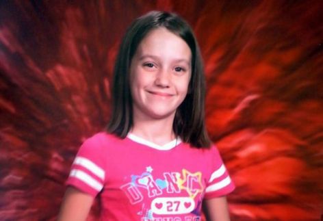 Sad young girl in pink shirt