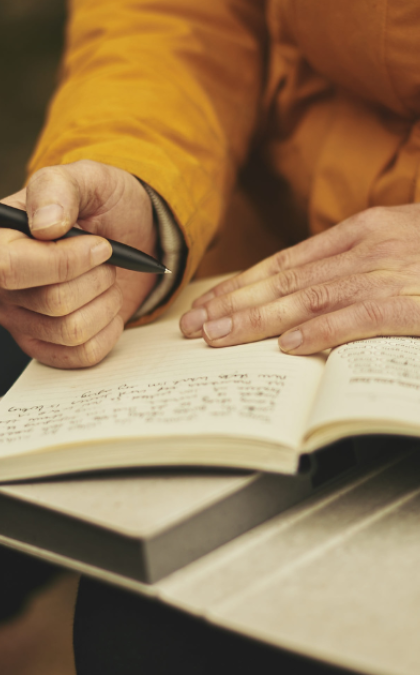 Person writing in notebook