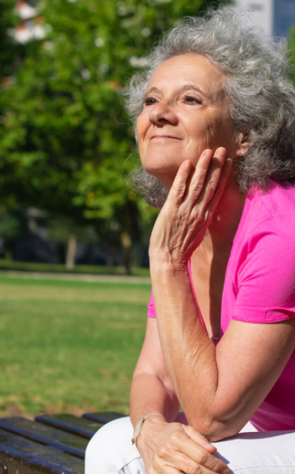 Woman relaxing on outdoor bench