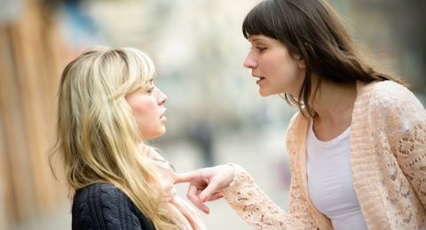 Two women in tense discussion