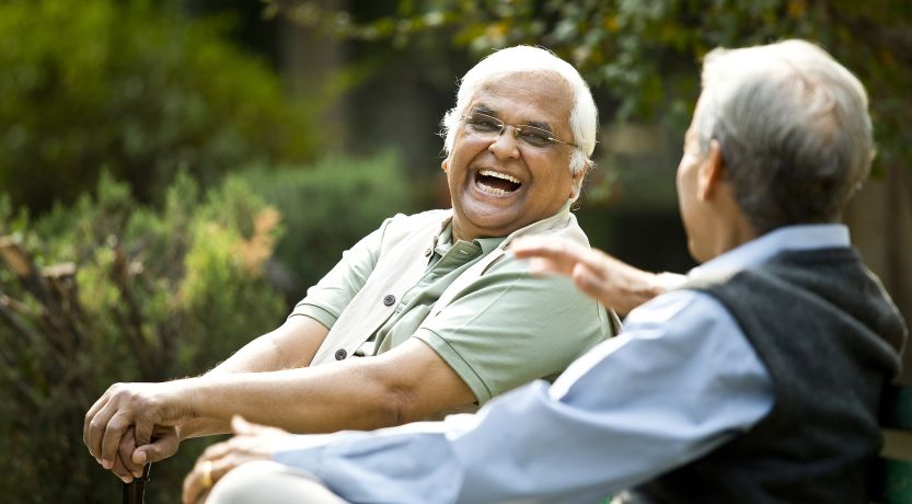 Friends laughing outdoors