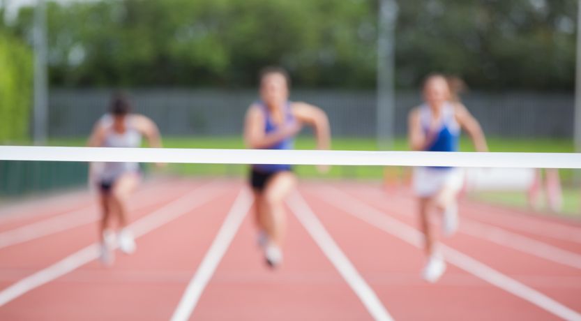 Three women jogging on track