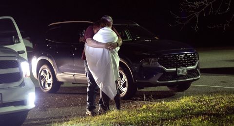 Couple embraces after mass shooting