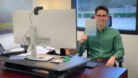 Man holding grace booklet