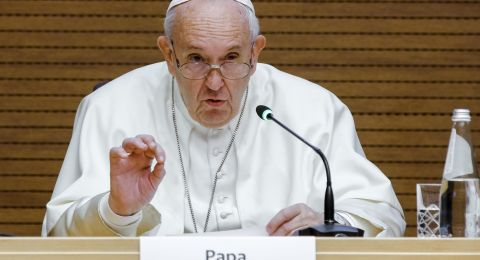 Pope speaking at Vatican podium