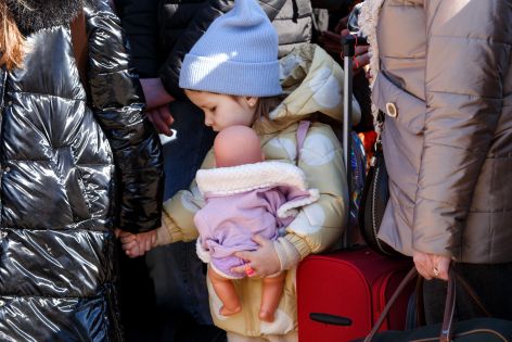 Ukrainian girl holding doll