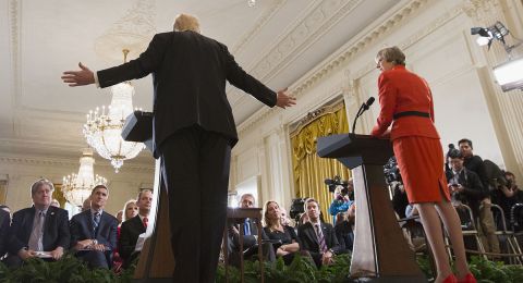 Two politicians speaking at podiums