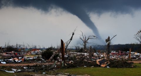 Tornado aftermath with scattered building debris