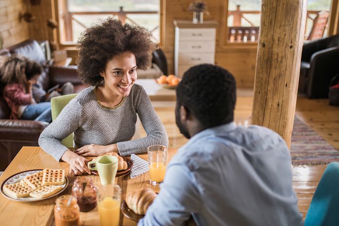 Couple discussing at indoor table