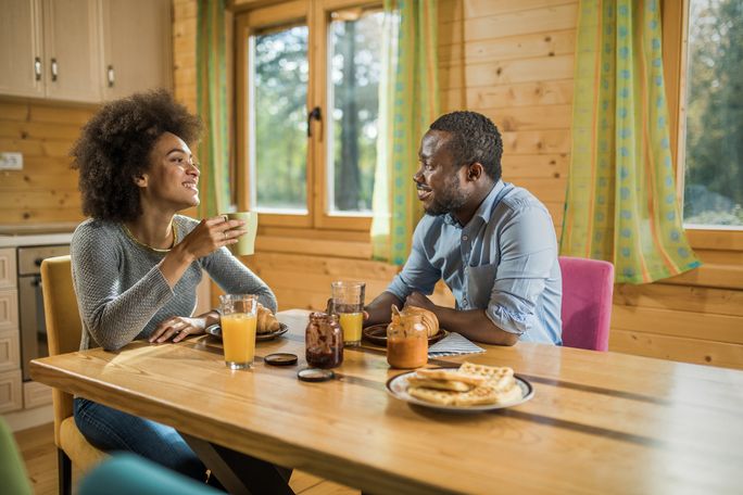 Couple sitting at breakfast table