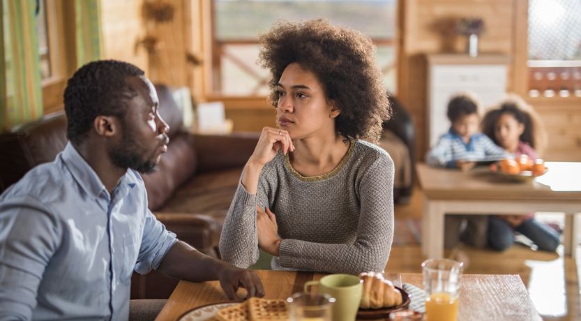 Couple having serious discussion at table