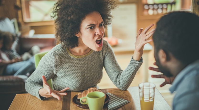 Woman angrily confronting man