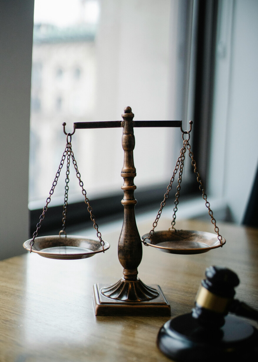 Bronze scale on wooden table