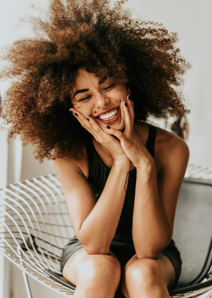 Happy smiling woman looking at camera