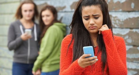 Three girls, one appears distressed